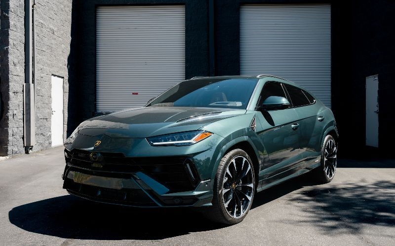 Green Lamborghini Urus Luxury Suv Parked Outside Dream Exotics Miami, Featured In The Exotic And Luxury Rental Fleet In Miami, Florida.