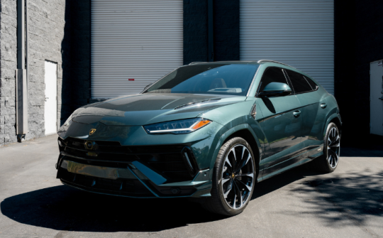 Green Lamborghini Urus luxury SUV rental photographed outside Dream Exotics Miami available in Miami and Fort Lauderdale
